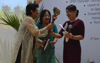 Dr. Melinda dP. Bandalaria takes oath as UPOU's fourth Chancellor at university's 21st anniversary celebration.