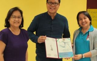 The photo of Asst. Prof. Rameses A. de Jesus recieving his certificate.
