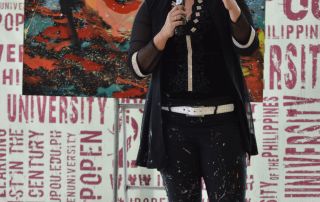 A picture of Ms. Cagandahan, a full-time contemporary visual artist from Paete, Laguna with a degree in Fine Arts from UP Diliman.