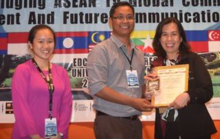 Ms. Rhonna Marie Verena (R) accepts the Best Presentation Award at the 3rd ASEAN University Conference on Public Relations and Communications (APRC) 2017.