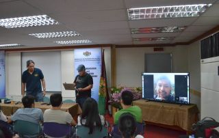 One of the older students clarifies procedures for his MMS 200 with Dr. Maranan
