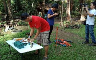 Jabez setting up sampling plots in Quezon with research assistant, Ara Bagunu and documentary filmmaker, Brian Sulicipan (2018). Photo credit: Michael Reyes, Jr.