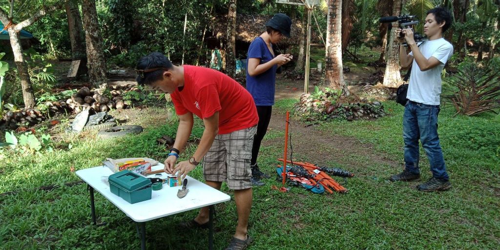 Jabez setting up sampling plots in Quezon with research assistant, Ara Bagunu and documentary filmmaker, Brian Sulicipan (2018). Photo credit: Michael Reyes, Jr.