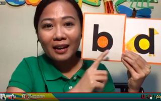 Teacher Michelle with her special alphabet cards.