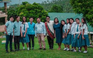 Mr. Bandoquillo with his BKD Officers and parents in Taysan Resettlement Integrated School during his UPOU Virtual Graduation. He insisted on sharing his graduation moment with his students to inspire them to always acknowledge their parents’ efforts in achieving one’s success. 