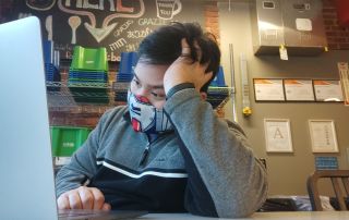 Isaiah Crisanto studying on the road