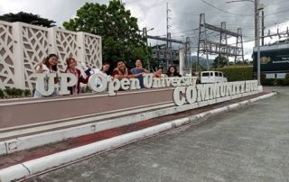 ProvComm Members in front of the UPOU Community Hub Sign
