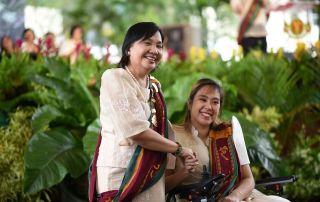 Joanne Laurice Caguicla (seated) with Dr. Melinda dela Peña Bandalaria, UPOU Chancellor.