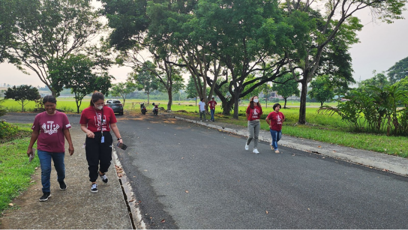 UPOU FMDS employees jogging around the campus.