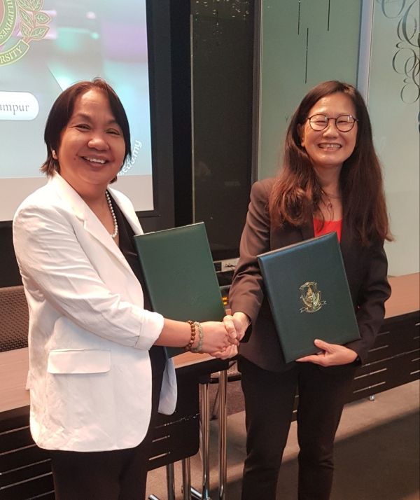 UPOU Chancellor Dr. Melinda dela Peña Bandalaria and WOU Chief Executive and Vice Chancellor Dr. Lily Chan