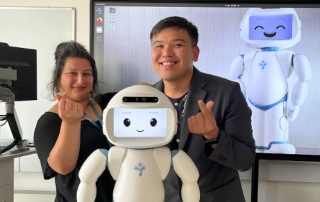Prof. Mona Nasser of University of Plymouth with Dr. Roberto Figueroa Jr and Q, the robot.