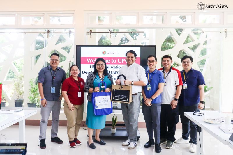 Director Ria Valerie Cabanes from UPOU QAO and Director Allan Paul Tang of the LEAD Center at Miriam College (center) with UPOU and LEAD Center personnel.
