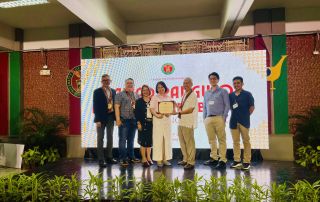 Dr. Rita C. Ramos (center) receives recognition at the Gawad Pangulo para sa Natatanging Inobasyon: Paglalahad ng mga Likha