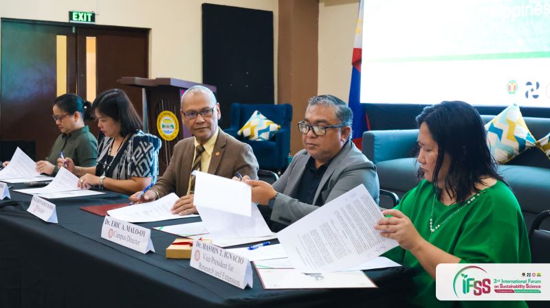 Representatives from UPOU, DOST–NIR and TUP Visayas sign a Memorandum of Agreement during IFSS 2025.