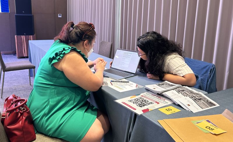 Asst. Prof. Lorena Jean Saludadez engaged with the OFWs in the UPOU Booth in the Service Caravan and 17th Multi-Agency Service Mission in Phnom Penh, Cambodia