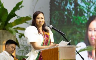 Ms. Kia Obang delivers the message as the representative of the graduating class.