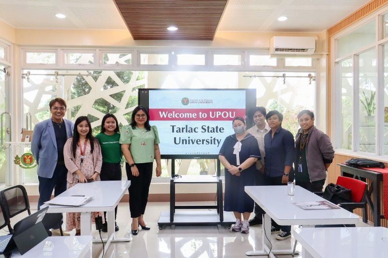 TSU and UPOU Officials and staff members during a photo opportunity and exchange of tokens.
