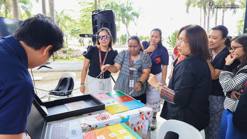 UPOU faculty and staff members enjoy educational games at the EduPerya 2026.