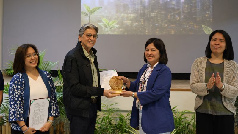 Chancellor Serrano awards Dr. Urooj Malik a token of appreciation.