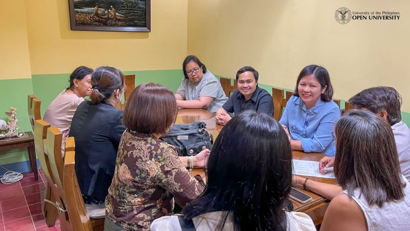 Chancellor Serrano and her team in a meeting with officials of the Universidad de Santa Isabel de Naga.