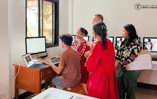 A young member of the Daraghuyan Tribe explores one of the newly donated computer units.