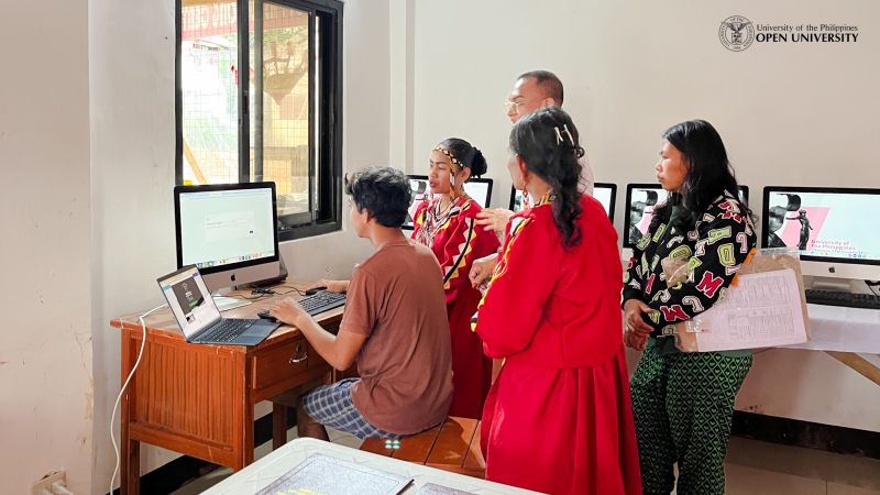 A young member of the Daraghuyan Tribe explores one of the newly donated computer units.