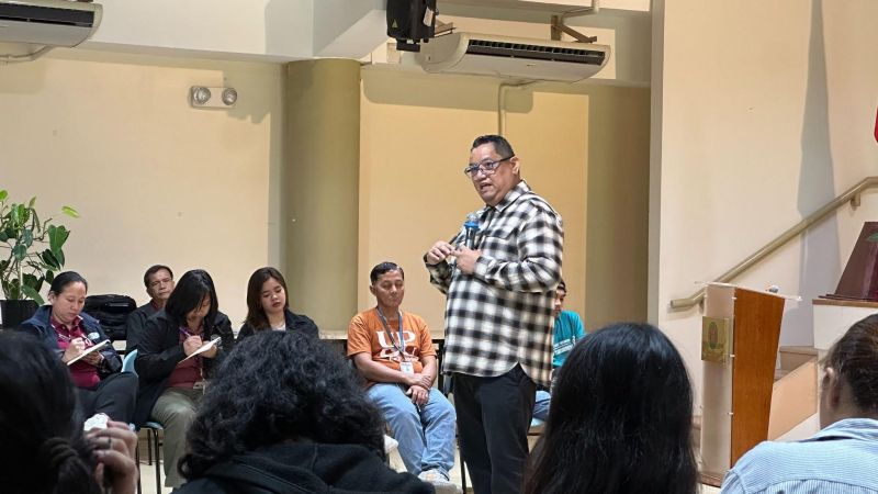 Assoc. Prof. Richard S. Javier leads the ROSES session as participants listen to discussions on emotional intelligence, communication, and workplace relationships.